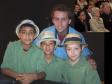 Na foto Luiz Felipe Vieira Marques (pandeiro), Lucas Willian Silva (cavaquinho) e Atílio Mauricio Rodrigues Puka (flauta) , todos com 10 anos de idade e o professor da rede estadual de educação e da Casa de Música de Paranaguá, Rafael Palotino