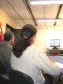 Participantes da vídeo conferência na CELEPAR, em primeiro plano é a Elaine M. V. Kawa, CELEPAR e o Diretor Presidente da CELEPAR, Nizan Pereira 