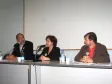 A partir da esq., o secretário especial para Assuntos Estratégicos e diretor-presidente da CELEPAR, Nizan Pereira, a coordenadora da mesa redonda, Zélia Passos e o Coordenador da ONG Terra de Direitos, Darci Frigo 