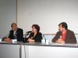 A partir da esq., o secretário especial para Assuntos Estratégicos e diretor-presidente da CELEPAR, Nizan Pereira, a coordenadora da mesa redonda, Zélia Passos e o Coordenador da ONG Terra de Direitos, Darci Frigo 