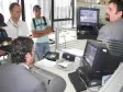 O Diretor de Desenvolvimento, Henrique Salatino Miorelli, o gerente de Desenvolvimento da Celepar Márcio Luiz Hein