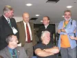 Sentado Governador do Estado do Paraná Roberto Requião, em pé à direira Cláudio Crossetti Dutra, Diretor de Serviços IP e Multimídia da CELEPAR e em pé à esquerda Presidente do Serpro Marcos Mazoni