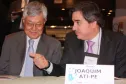 A esq. o representante do governador Beto Richa no evento, o secretário do Planejamento e Coordenação Geral, Cassio Taniguchi, presidente do Conselho de Administração da Celepar e do Conselho Estadual de Informação e Telecomunicações (COSIT) e o presidente do Conselho de Associadas, Joaquim José Fernandes da Costa Junior
