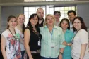 Na foto, Aparecida Cássia Pereira da DIDES-G2 (de azul claro)